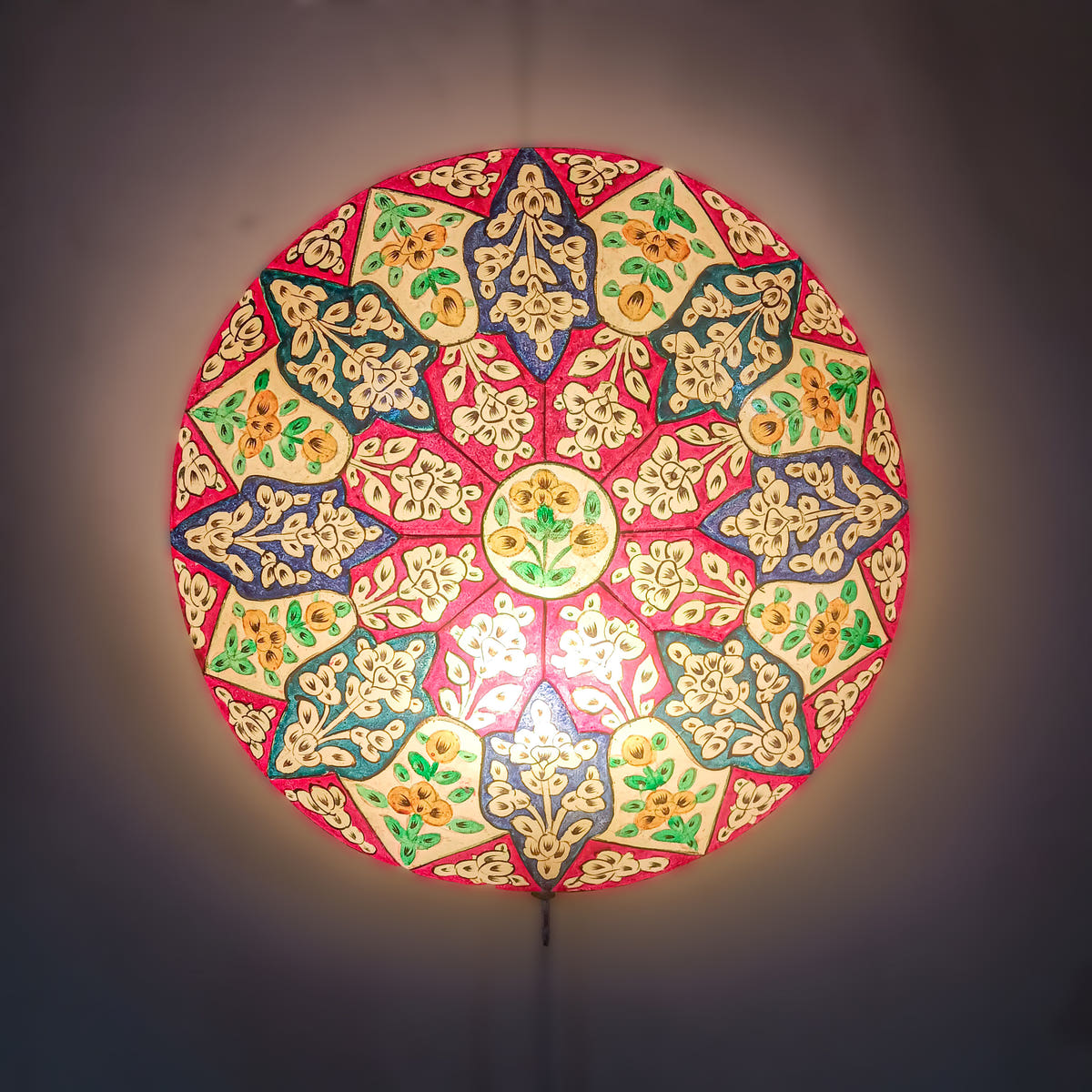 Peacock Motif Wall Lamp, Camel Skin, lit view